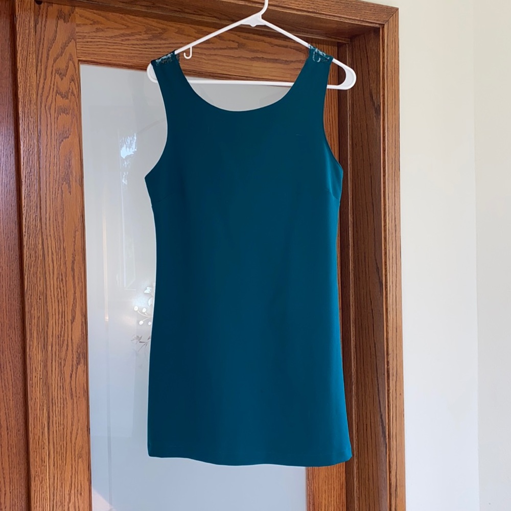 Teal colored dress with lace detail on the back